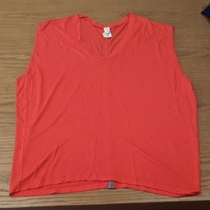 Red sleeveless dolman shirt with leather detail